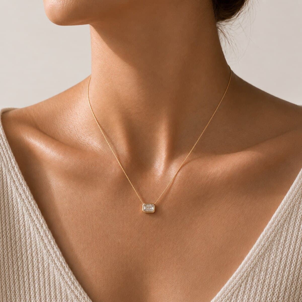 Necklace photographed on-model, styled to the brand