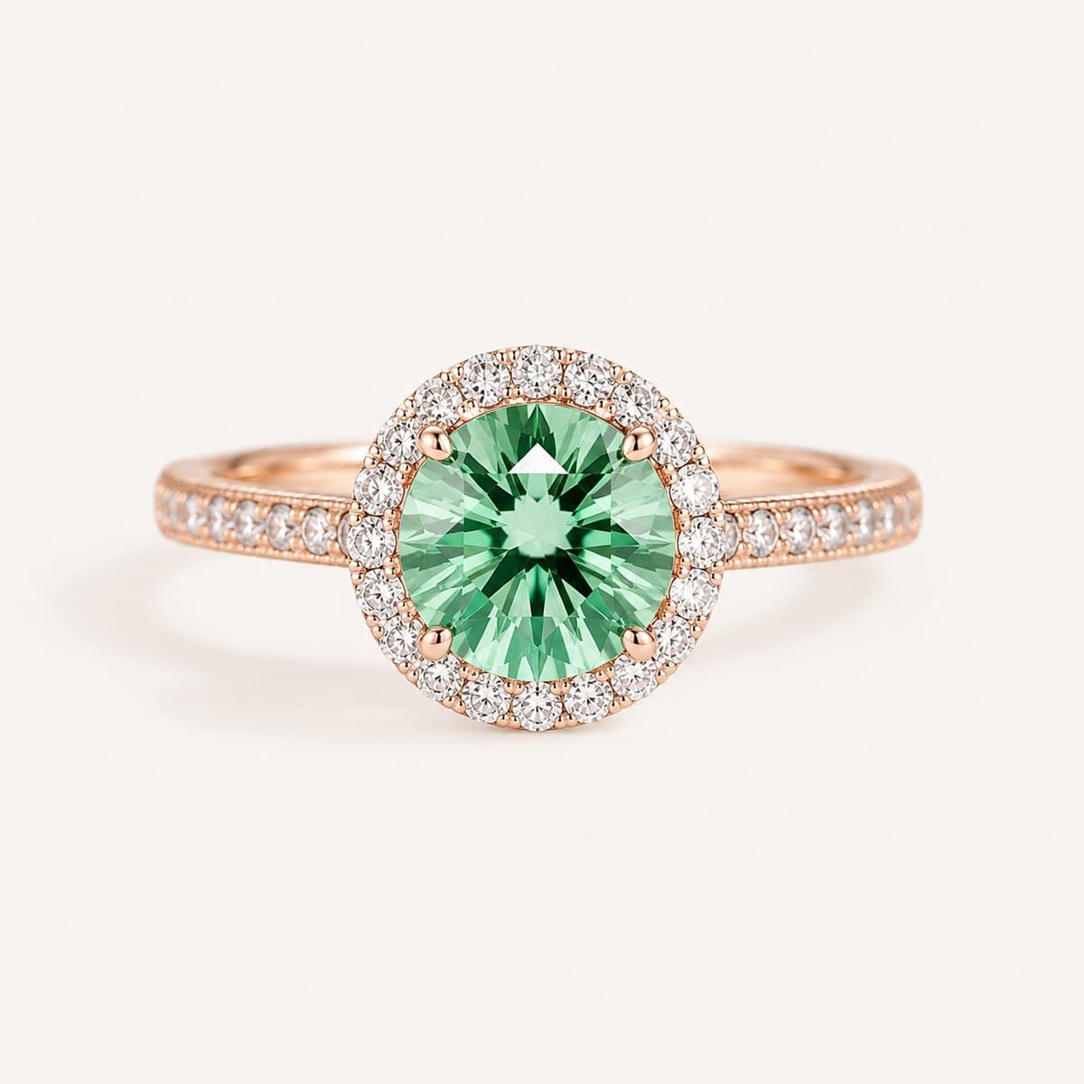 Green gemstone halo ring